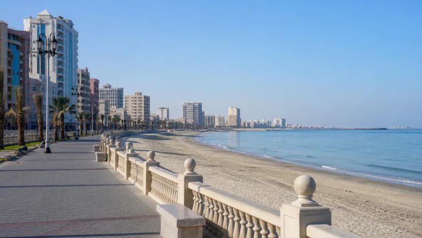 Ajman waterfront and city skyline in the United Arab Emirates.